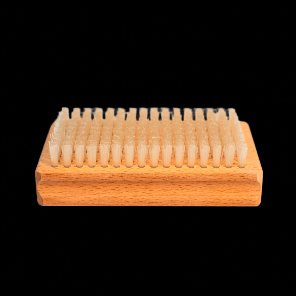 Nylon bristles of the Budder Brush face up for ski and snowboard wax maintenance.