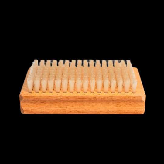 Nylon bristles of the Budder Brush face up for ski and snowboard wax maintenance.