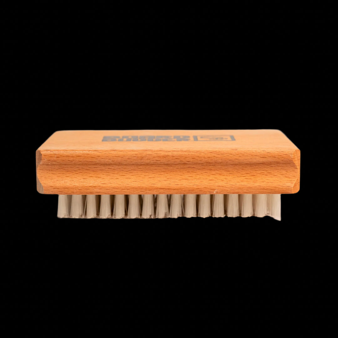 Budder Brush with nylon bristles face down, ideal for waxing skis and snowboards.