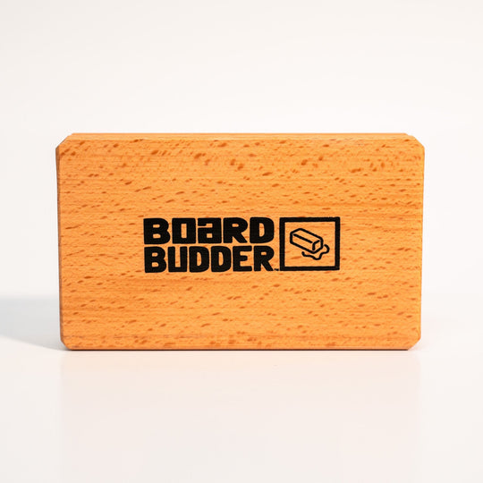 Board Budder logo on the wooden handle of the Budder Brush