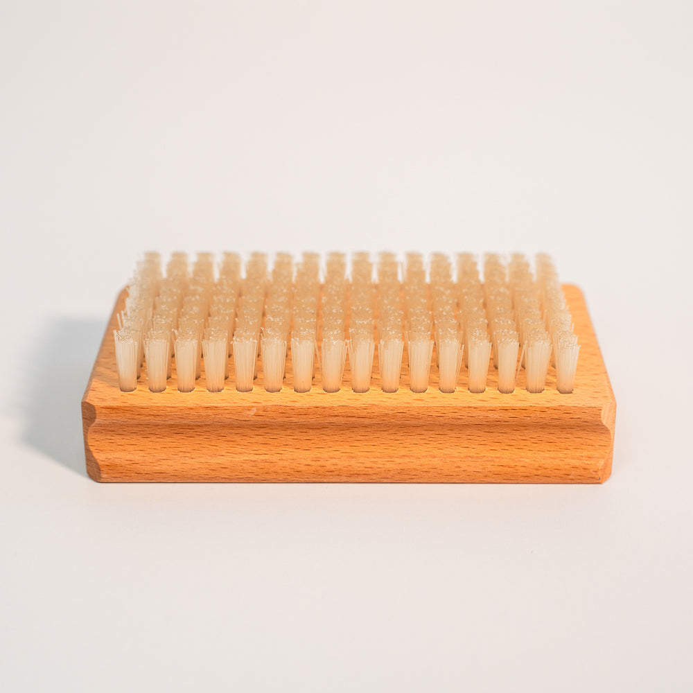 Nylon bristles of the Budder Brush face up for ski and snowboard wax maintenance.