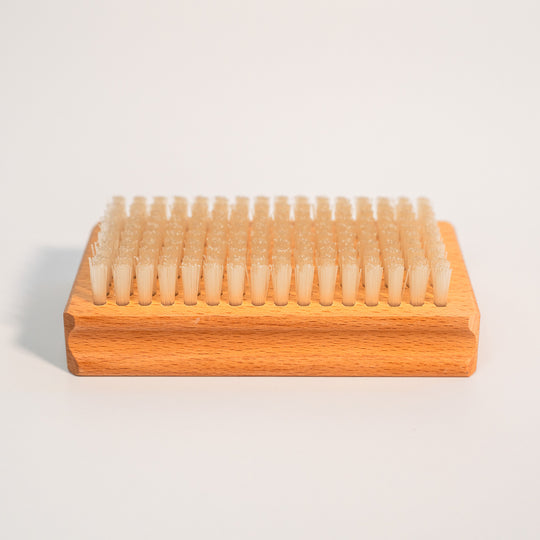 Nylon bristles of the Budder Brush face up for ski and snowboard wax maintenance.