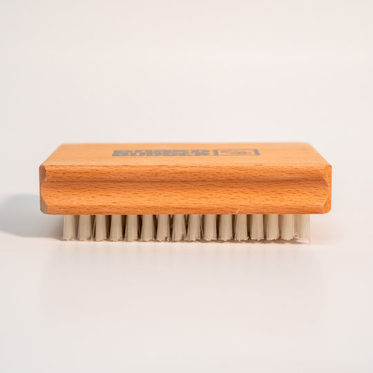 Budder Brush with nylon bristles face down, ideal for waxing skis and snowboards.