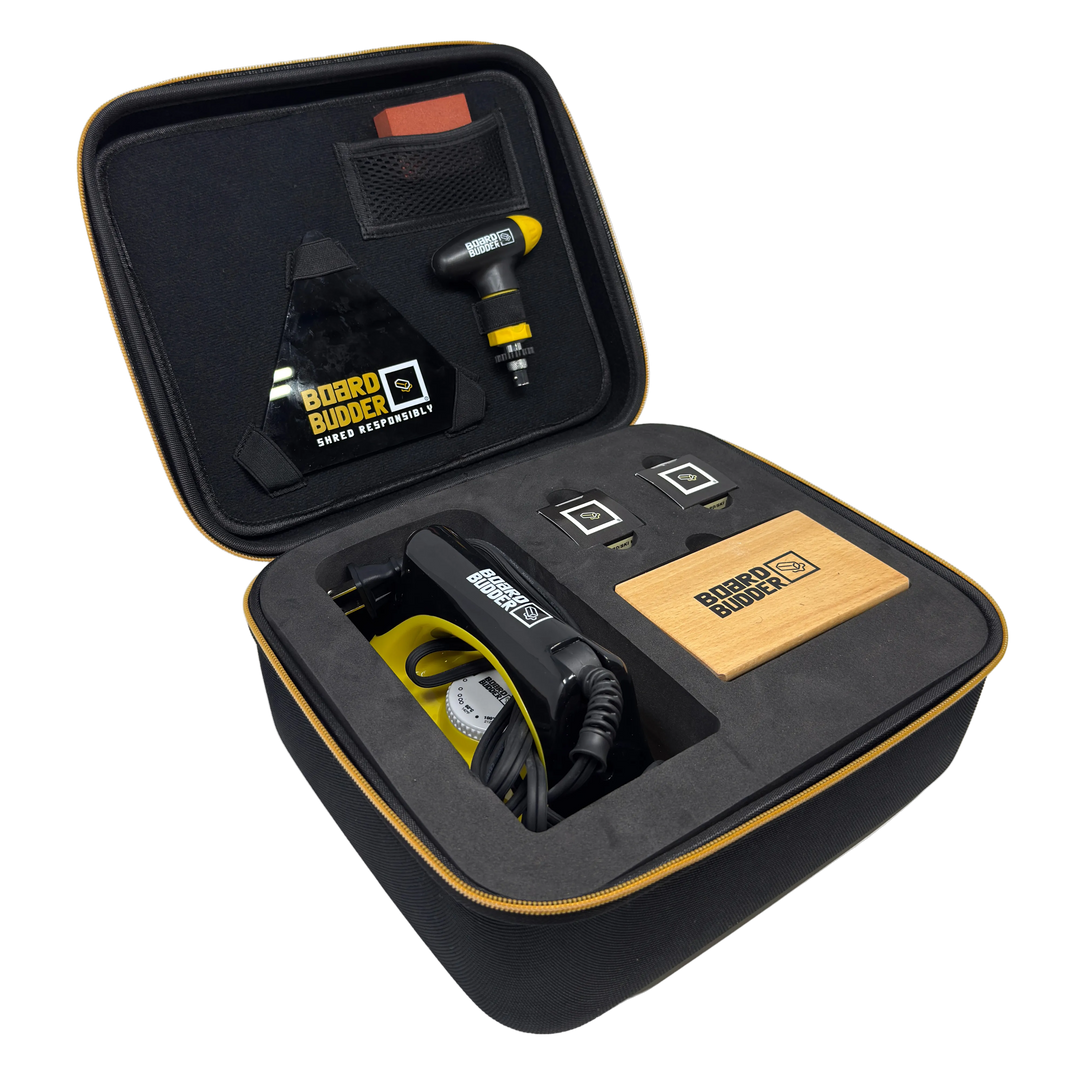 Black carrying case with ski tuning tools and equipment, featuring board budder glide wax